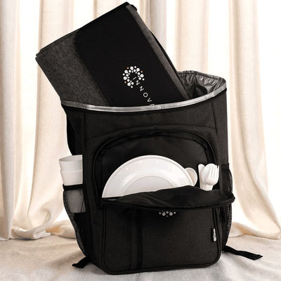 Picnic Pack - A black picnic backpack with a grey blanket, plates, cutlery, and a drink bottle in external pockets.