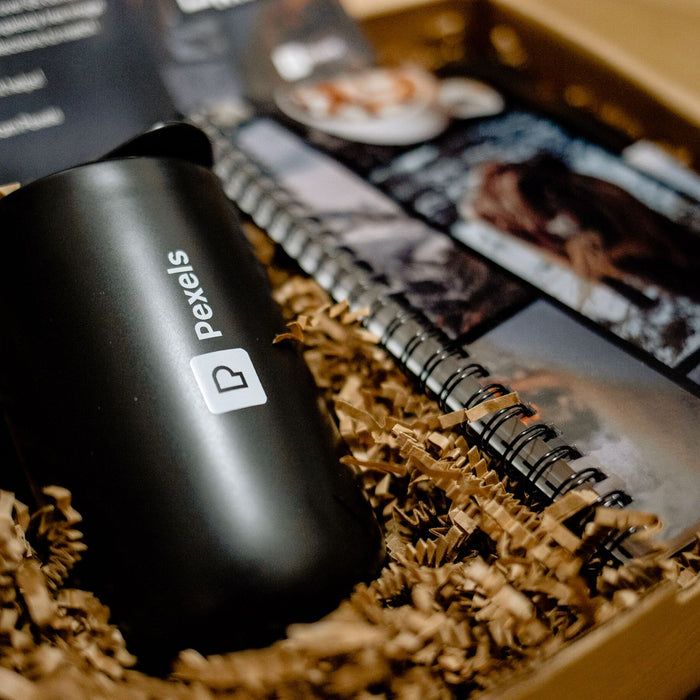 Elegant gift box featuring a branded mug and notebook, ideal for corporate events.