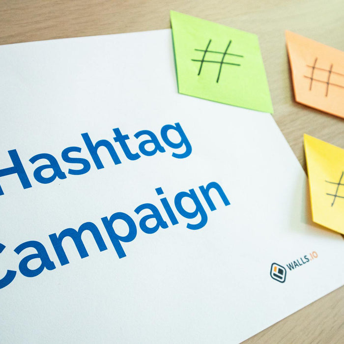 An organized workspace with hashtag campaign materials and colorful sticky notes.