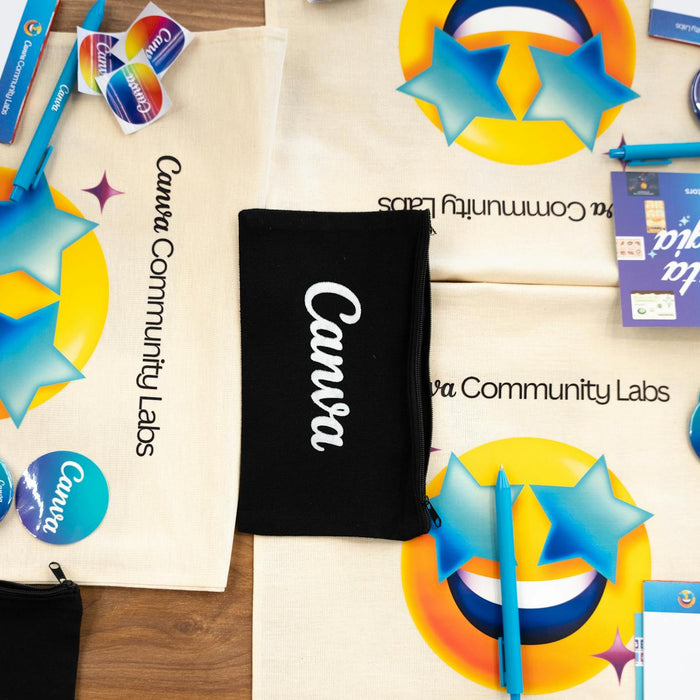 Flat lay of Canva Community Labs merchandise with vibrant design and branding elements.