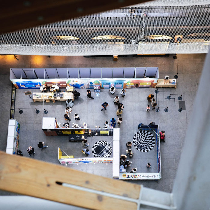 Top view of a bustling indoor exhibition space in Taipei, Taiwan.