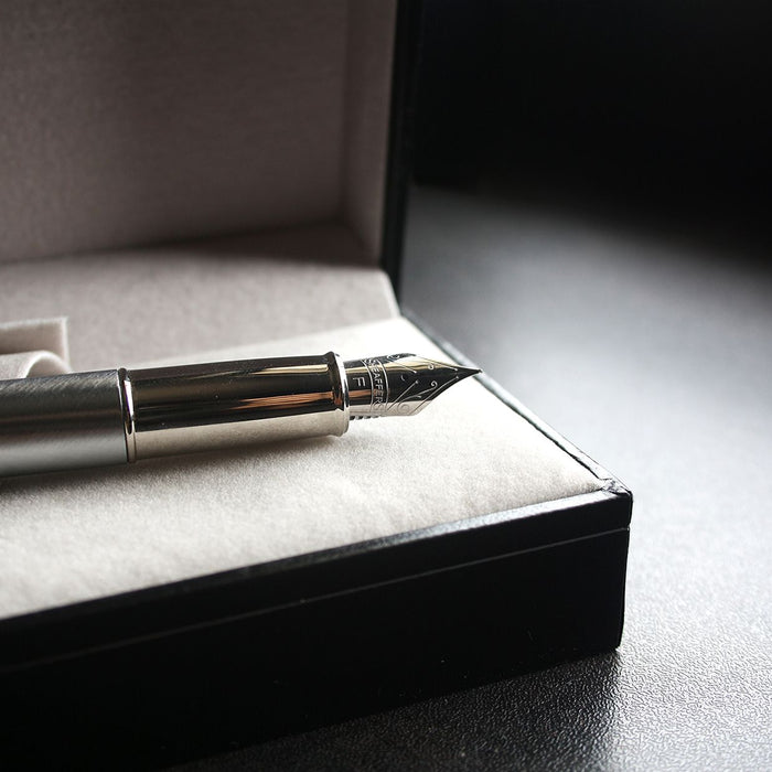 Close-up of a luxury fountain pen in a velvet-lined box, perfect for gifting.
