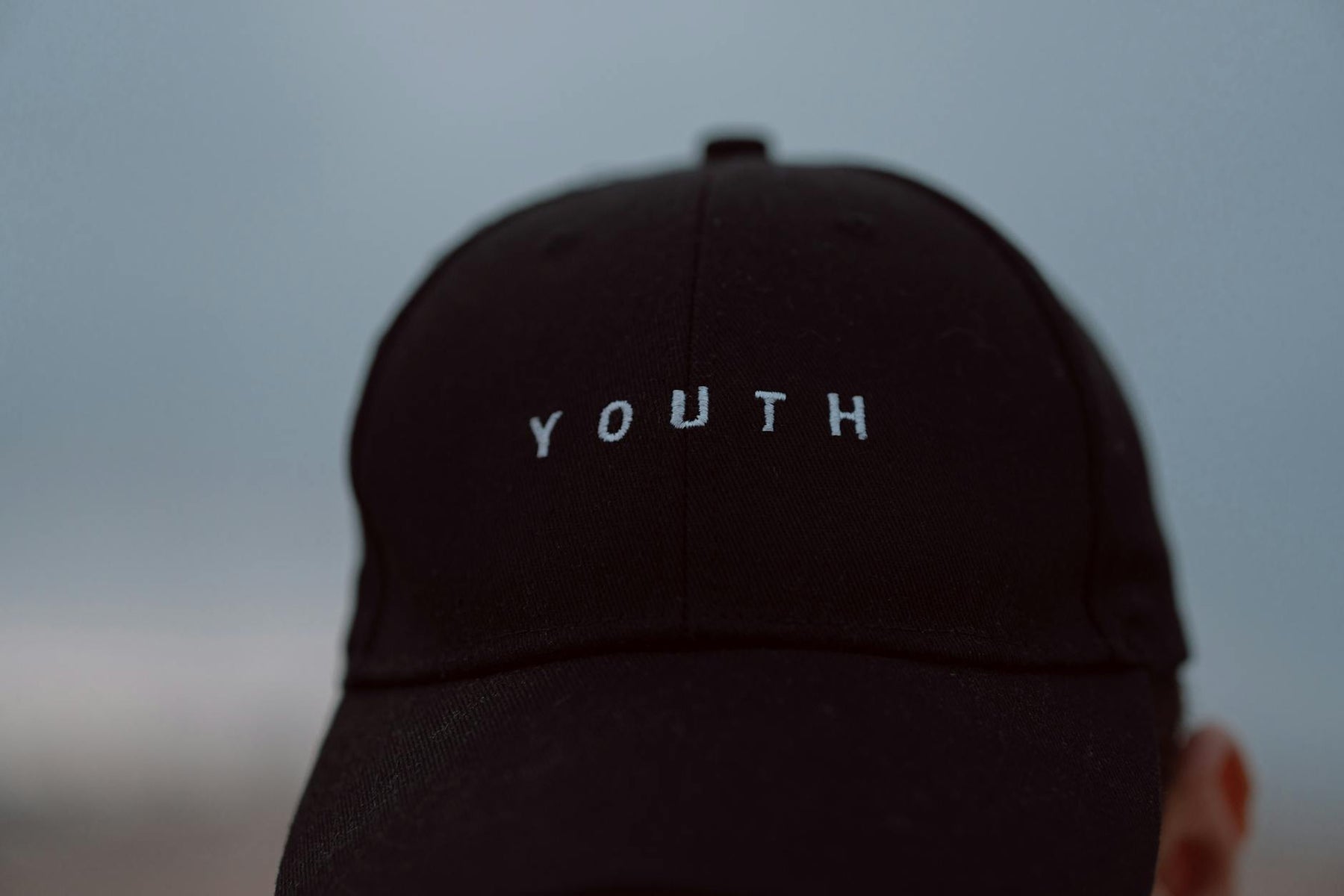 Close-up view of a black cap with 'Youth' text in Casablanca, Morocco.