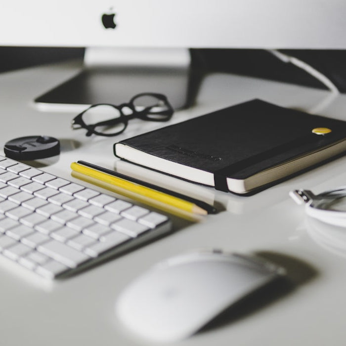 Apple Magic Keyboard and Apple Magic Mouse on white table