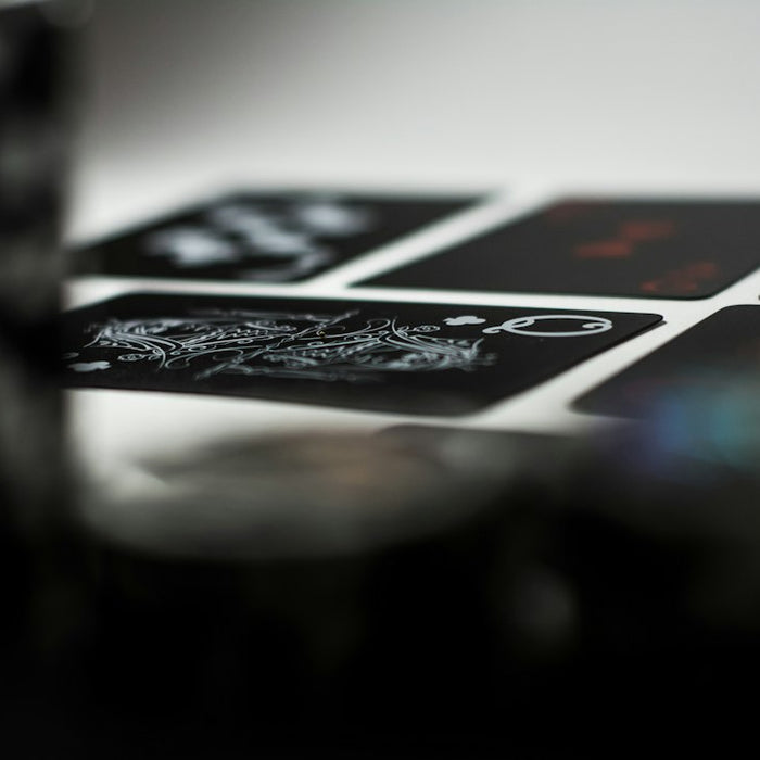 a stack of playing cards sitting on top of a table