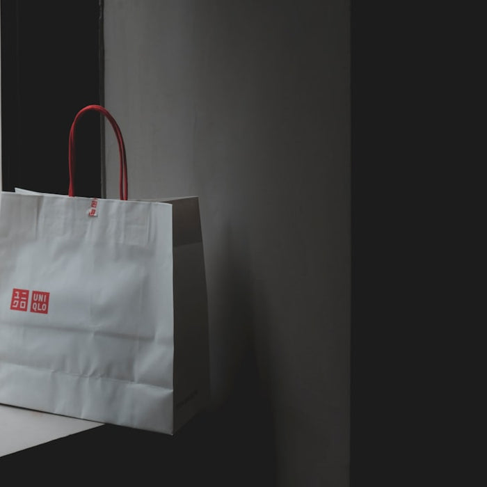 white paper bag near window panel