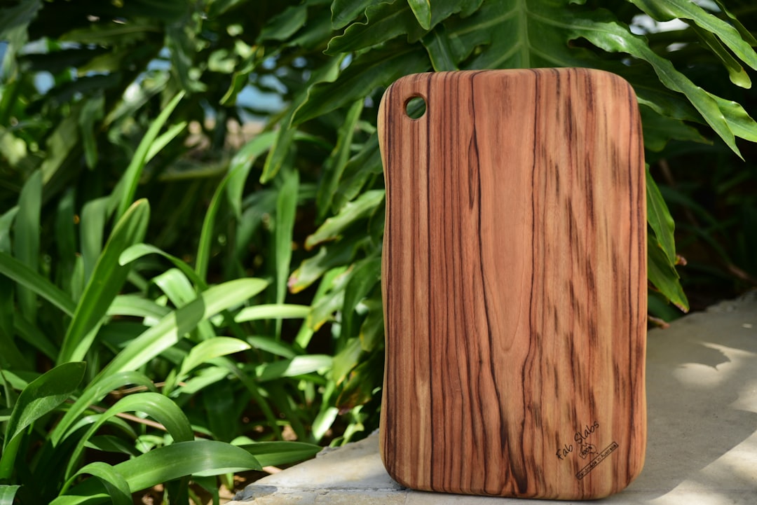 a wooden case sitting on top of a stone wall