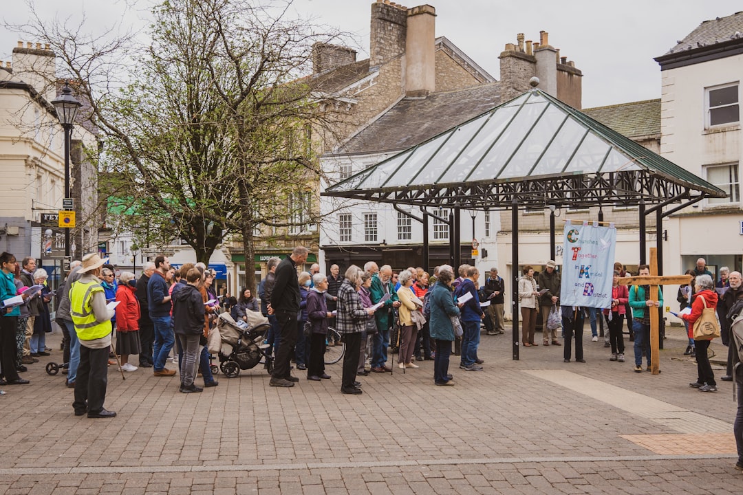a crowd of people standing around a building