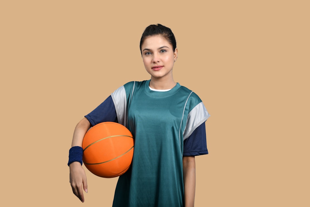 a man holding a basketball