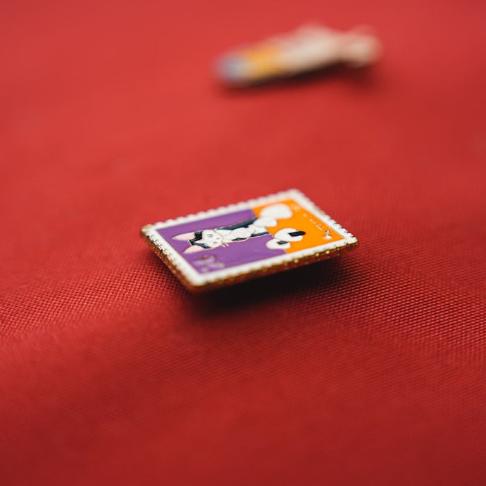 a close up of a button on a red cloth