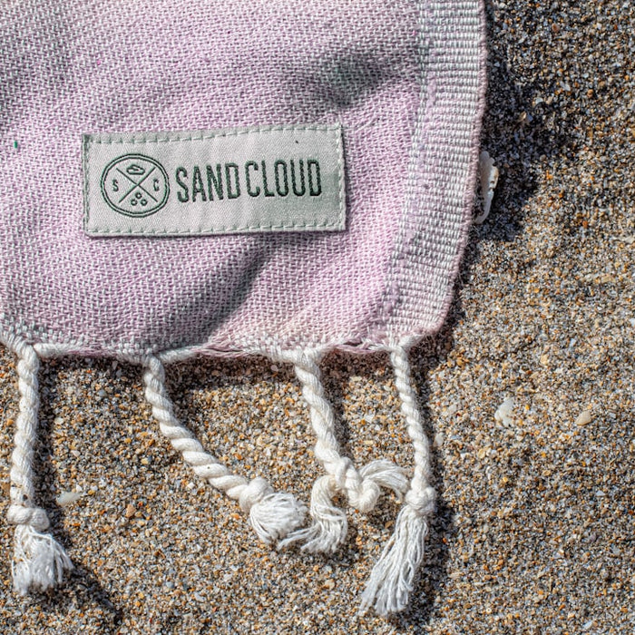a close up of a towel on the sand
