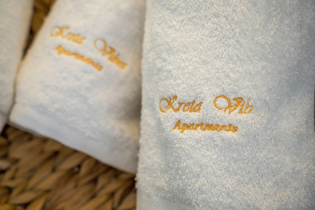 a close up of towels on a wicker basket