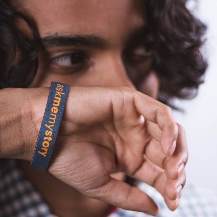 a close up of a person wearing a wristband