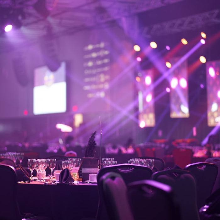 a room filled with lots of tables and chairs