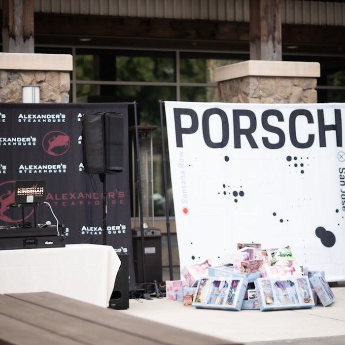 A wooden bench sitting in front of a sign