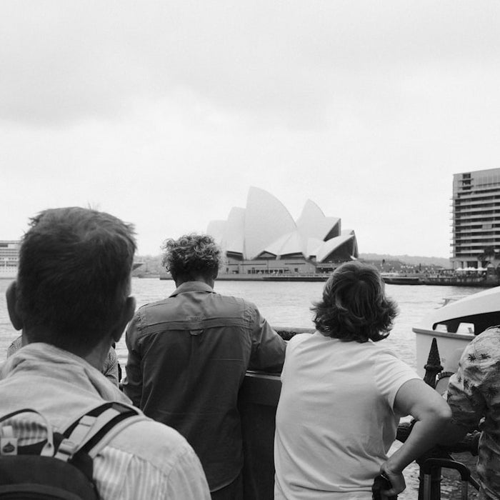 People are looking at the sydney opera house.