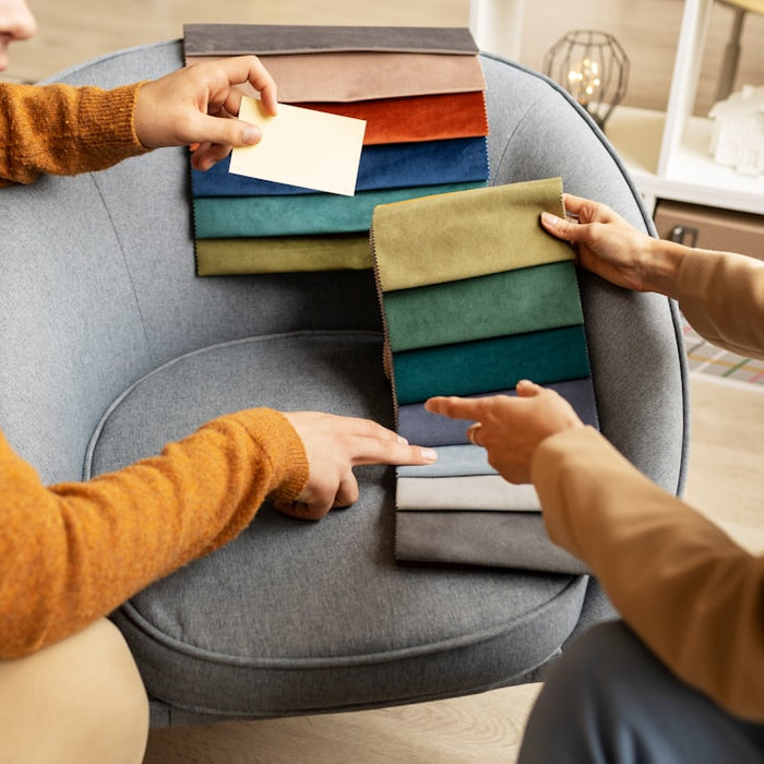 People choose fabrics for furniture.