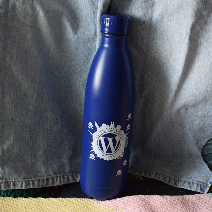 A blue water bottle is the main focus.