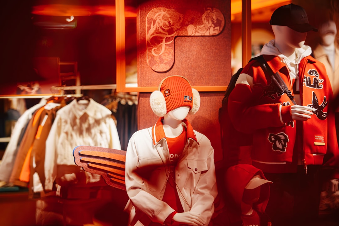 Mannequins display casual winter clothing in a store.