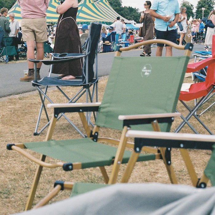 Folding chairs at a busy outdoor event