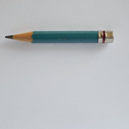 A single pencil on empty white background - minimum order quantity humour