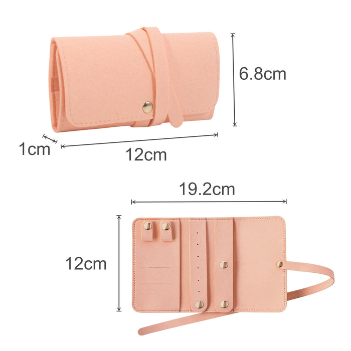 Synthetic Leather Jewellery Bag - A synthetic leather jewellery bag in a soft pink colour, featuring a strap and multiple compartments for accessories.