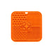 4-Section Dog Enrichment Lick Mat - An orange, four-section silicone lick mat with various textures, including paw prints and bone shapes.