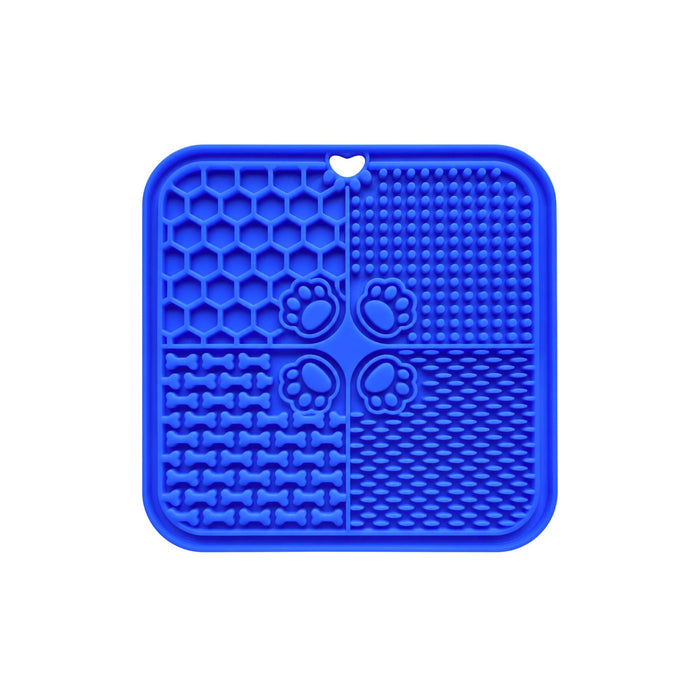 4-Section Dog Enrichment Lick Mat - A blue, four-section dog enrichment lick mat featuring various textured designs, including honeycomb and paw prints.