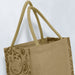 Monza Jute Tote Bag - A jute tote bag in a natural beige colour with twin handles and a patterned side design. It's unbranded.