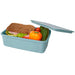 Seasons Dovi 800 ml Lunch Box - A light blue lunch box containing a sandwich, cucumber, cherry tomatoes, and a bell pepper. It has a lid and a logo.