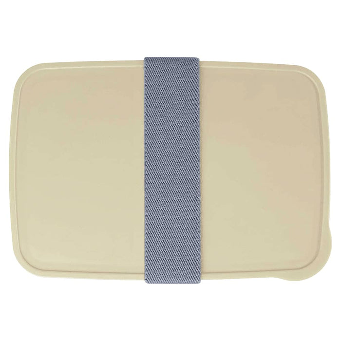 Seasons Dovi 800 ml Lunch Box - A cream-coloured lunch box with a denim-style elastic band. The design features a simple, rectangular shape and a logo.