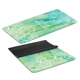 Mantra Yoga Mat - A yoga mat in shades of green, featuring a floral pattern and a black underside, with a logo prominently displayed.