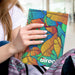 Lancia Full Colour Notebook - Large - A large notebook featuring a vibrant, multicoloured leaf design and a logo on the front cover.