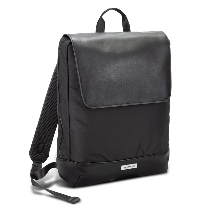 Moleskine Metro Slim Backpack - A sleek black backpack with a flap closure, featuring padded back straps and a brand logo on the front.
