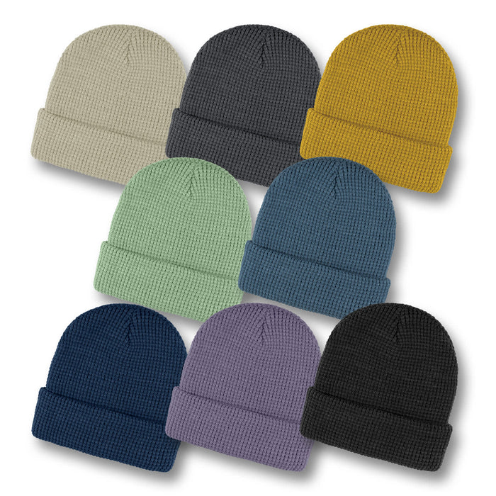 Galway Waffle Beanie - A set of Galway Waffle Beanies in various colours: beige, grey, mustard, green, navy, purple, and black.