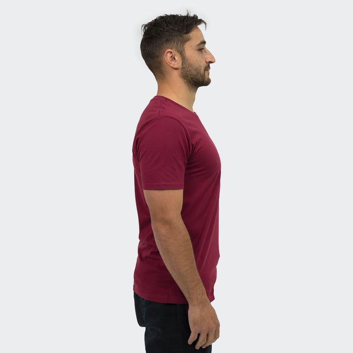 TRENDSWEAR Element Unisex T-Shirt - A unisex TRENDSWEAR Element T-shirt in maroon, viewed from the side, featuring a simple design and branding.