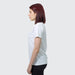TRENDSWEAR Viva Womens T-Shirt - A side view of a woman wearing a white TRENDSWEAR Viva women's T-shirt. The shirt has a simple design and a logo.