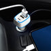 Photon Car Charger - A USB car charger in white and blue plugged into a vehicle's power socket, with a charging cable connected to a phone.