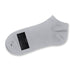 June Ankle Socks - A grey ankle sock made from soft material, featuring a logo and a label indicating size.
