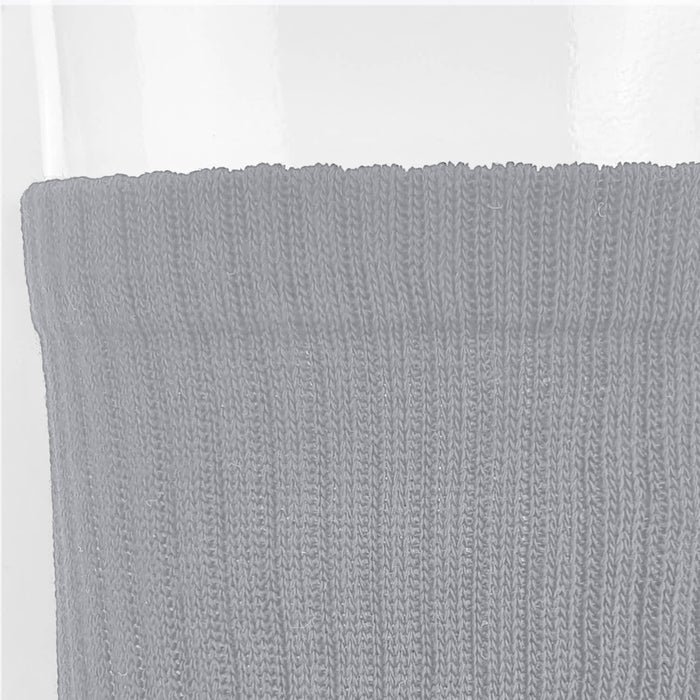 June Crew Socks - A pair of grey crew socks with a textured ribbed design, featuring a branding logo on the cuff.