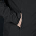 Swiss Peak Urban Softshell Jacket - A black softshell jacket featuring a zipped pocket and a smooth fabric texture. It has a logo on the surface.
