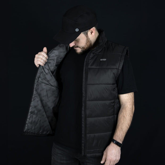 Swiss Peak Urban Puffer Vest - A man in a black Swiss Peak Urban Puffer Vest, holding it open to display the interior lining.