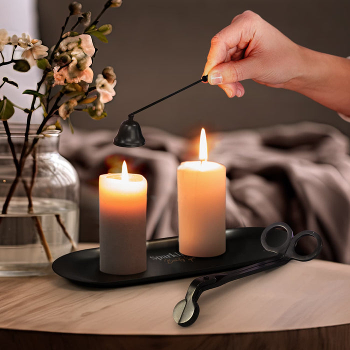 Keepsake Candle Accessory Set - A candle accessory set in black featuring a candle snuffer and a wick trimmer, positioned next to lit candles on a tray.