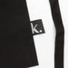 Keepsake Gardeners Set - A black gardening apron with a small logo tag on the side.