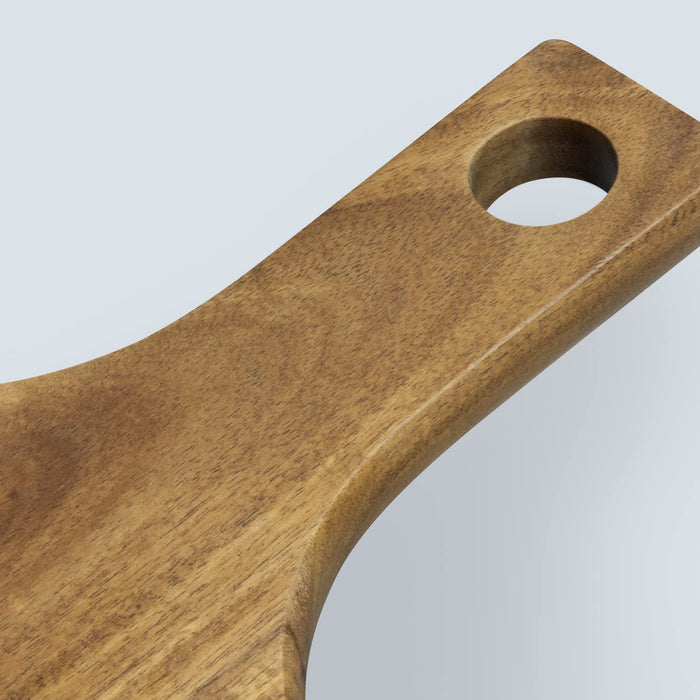 Keepsake Pizza Set - A wooden pizza board with a smooth finish and a circular hole in the handle.