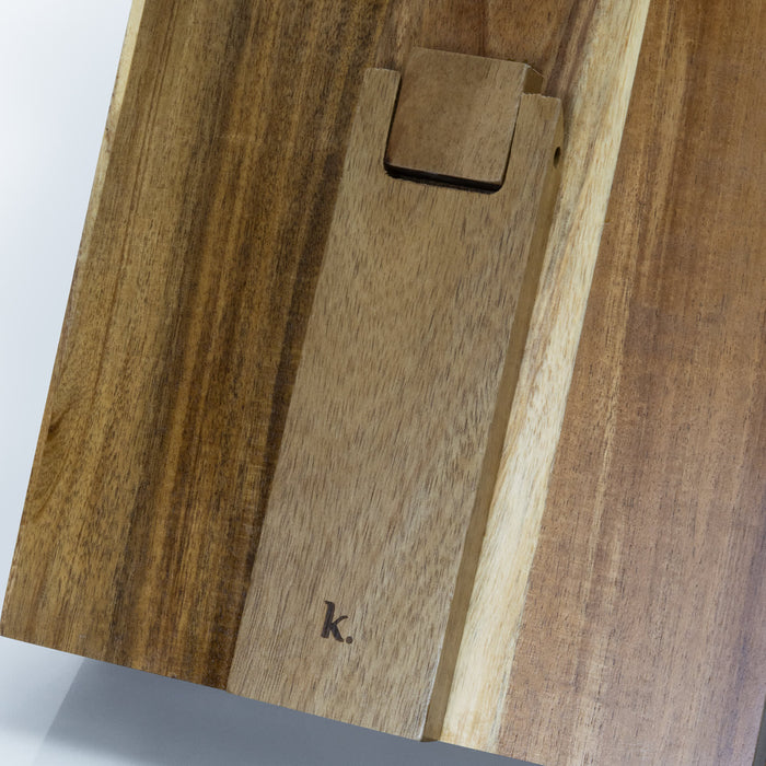 Keepsake Recipe Book Holder - A wooden recipe book holder featuring a smooth finish and a branding logo, showcasing rich brown tones.