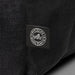 Oceana Recycled Backpack - A black backpack made from recycled ocean plastic with a small logo patch.