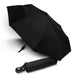 Colour Changing Compact Umbrella - A black compact umbrella displayed open, with a matching black cover beside it. The umbrella has a logo on the handle.