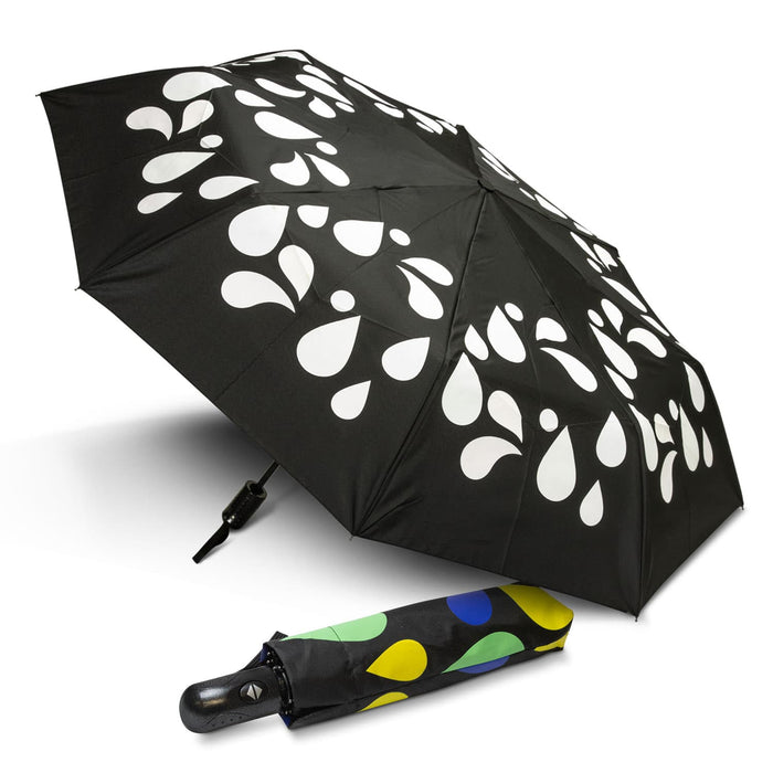 Colour Changing Compact Umbrella - A compact umbrella with a black canopy featuring white droplet patterns and a multicoloured case.