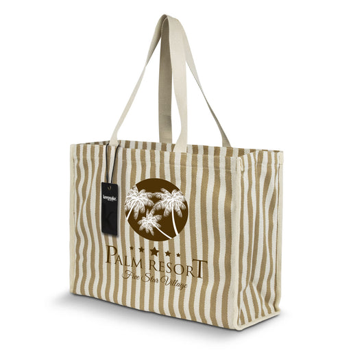 Keepsake Beach Tote Bag - A striped beige and white tote bag with palm tree design and branding. It has two handles for carrying.
